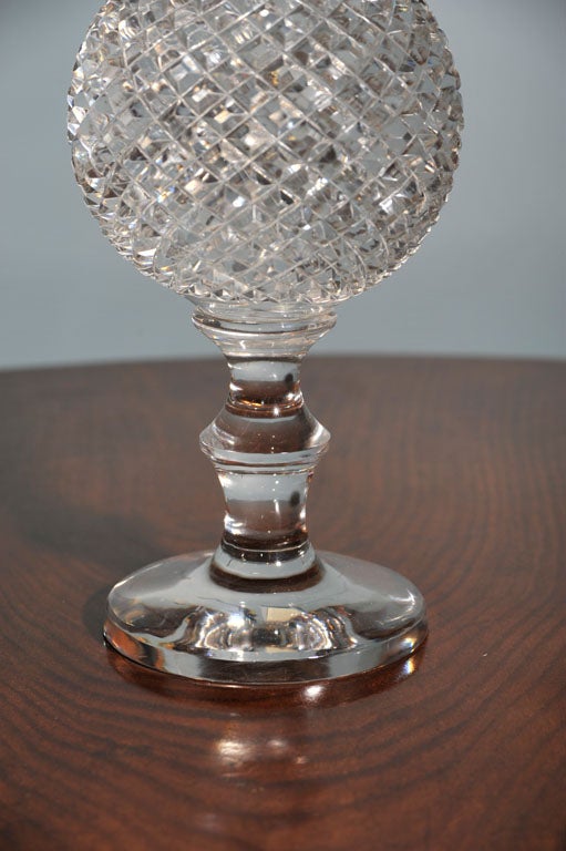 A striking  crystal ball on pedestal-a perfect accent piece!
