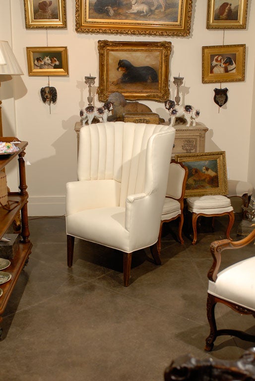 English barrel back/wing chair with muslin upholstery.