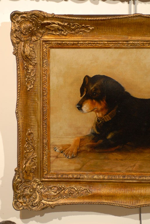 Dog painting, oil on canvas of reclining dog in antique gilt frame. unsigned.