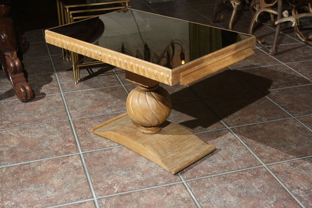 Jean-Charles Moreux style occasional table, cerused wood finish with oxidized glass top.