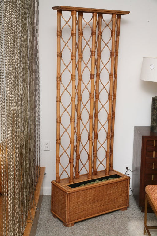 Rattan and woven matt room divider / planter.  ***Notes: Shipping Estimate to NYC: $250. There is no sales tax on this item if it is being shipped out of the state of Florida (Objects In The Loft will need a copy of the shipping document). Please