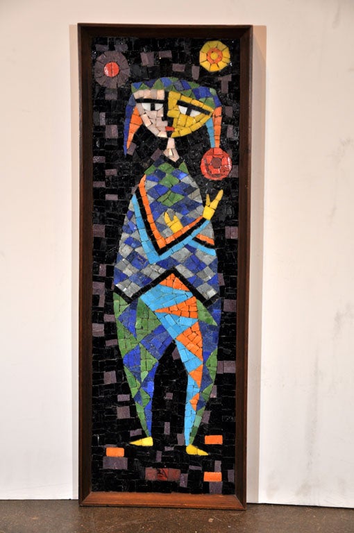 Glass mosaic depicting a jester juggling balls in wood frame designed by California artist Evelyn Ackerman. Ackerman is well known for her mosaic work as well as her tapestries, wood carvings and hook rugs.