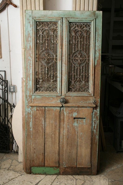 Painted oak with wrought iron grill and original hardware