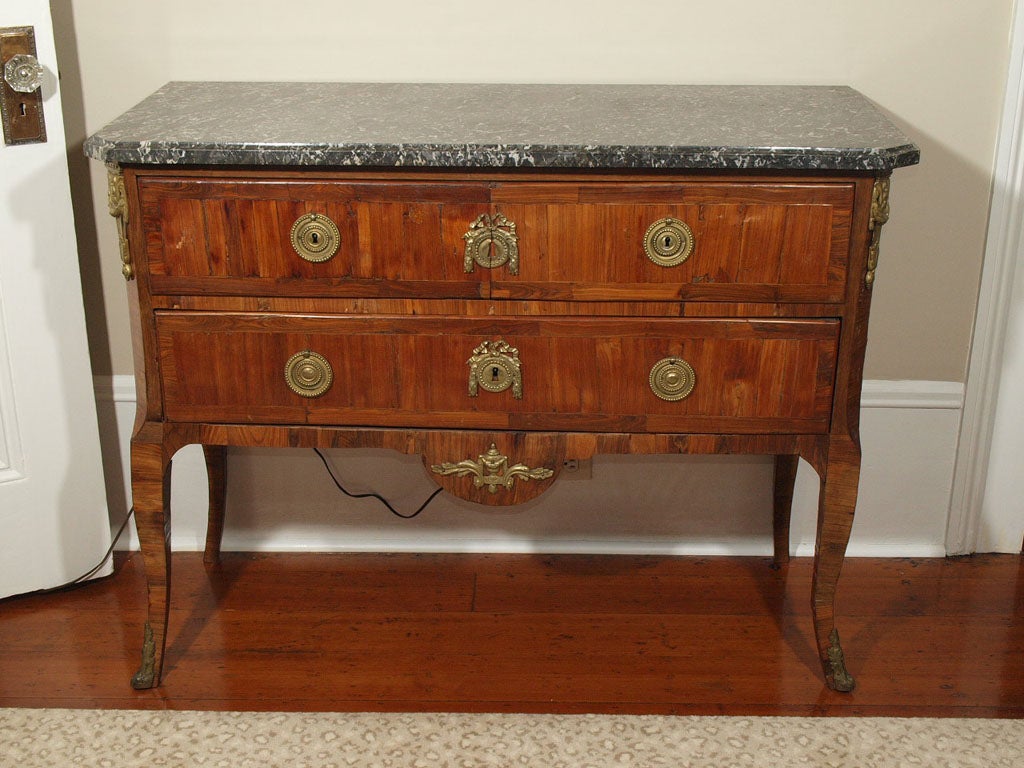 Period Louis XVI commode of pear wood and king wood. <br />
Grey and white marble top