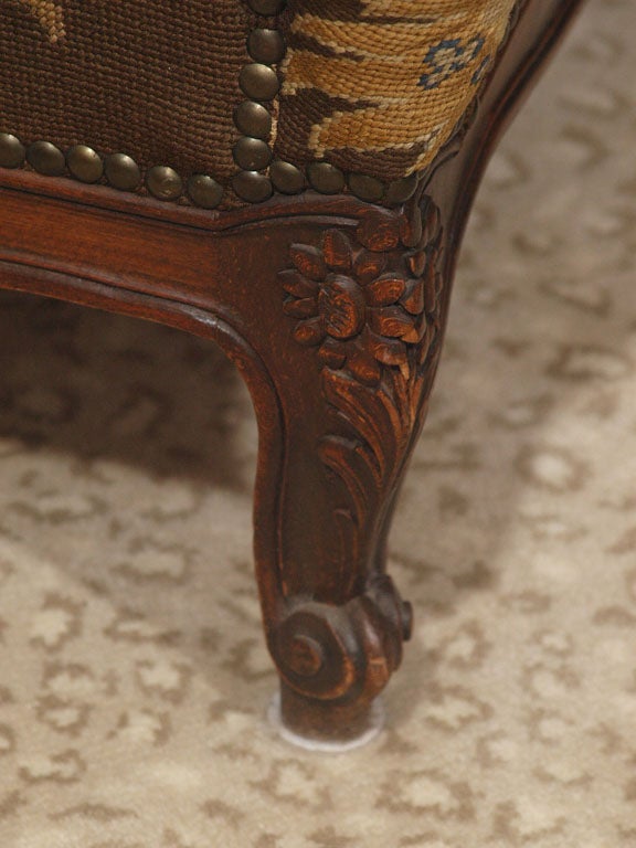 FRENCH WALNUT WINGCHAIR WITH NEEDLEPOINT UPHOLSTERY 1