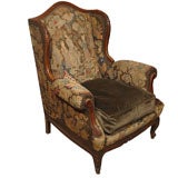 FRENCH WALNUT WINGCHAIR WITH NEEDLEPOINT UPHOLSTERY