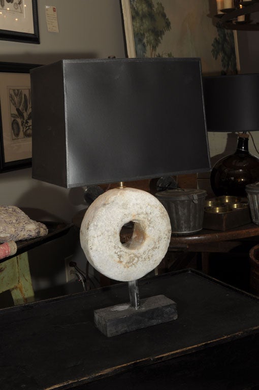 Pair of table lamps made with unusual round stone fragments mounted on metal & stone bases.  Custom shades available, separately priced.