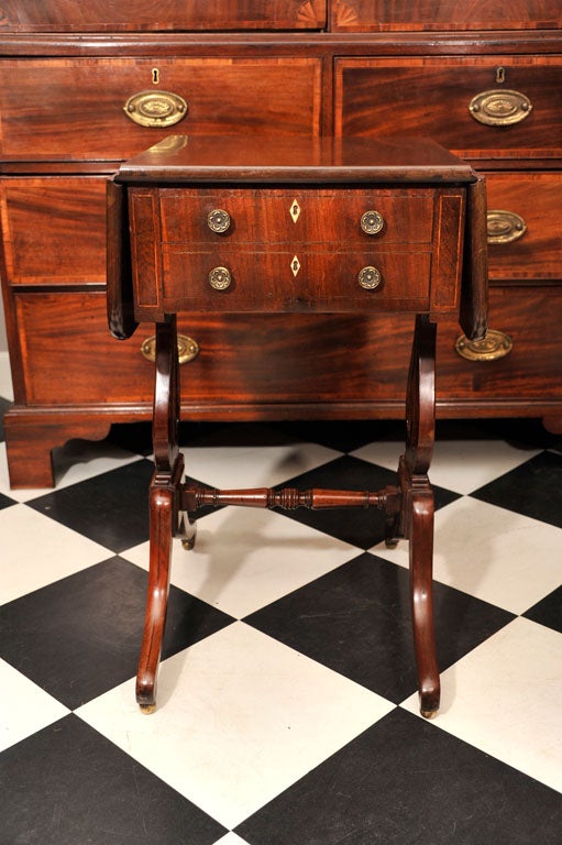 19th century mahogany work table with drop leaves.