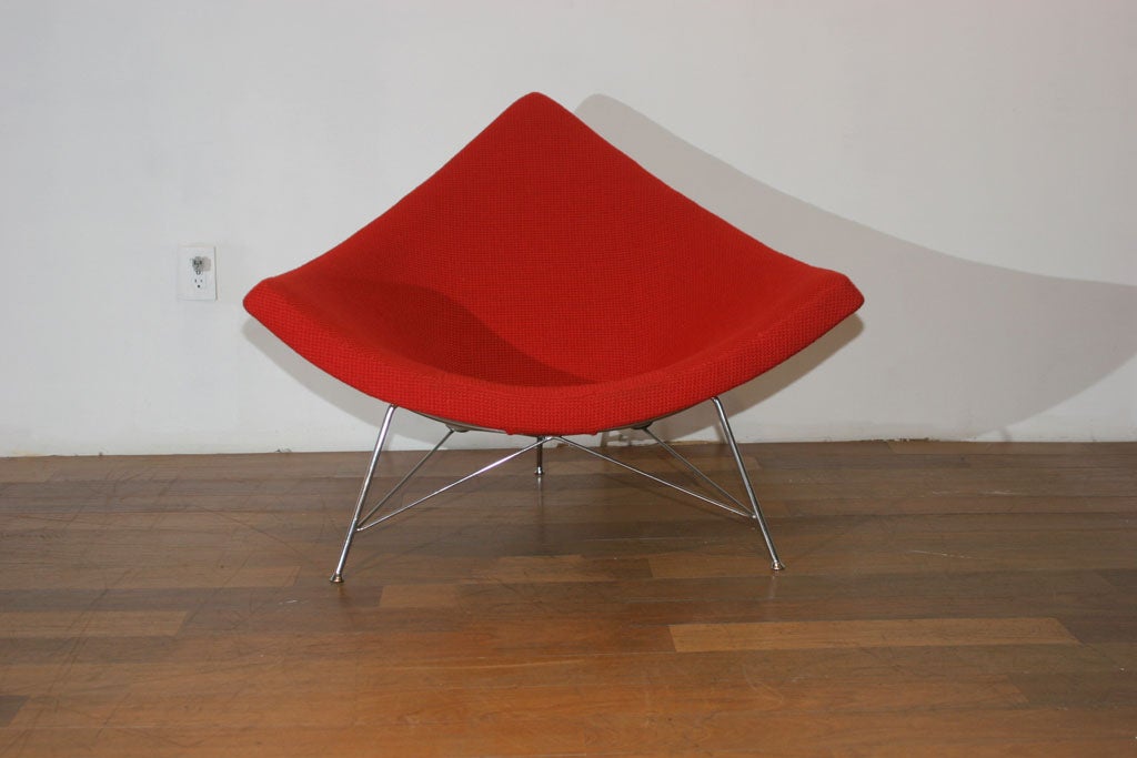 Very Early “STEEL SHELL” Edition Coconut, by George Nelson, for Herman Miller, c.1955. This chair is in PHENOMINAL CONDITION, foam is soft and supple, and ORIGINAL VINTAGE Cherry-Red “Alexander Girard” Textile Weave Fabric Upholstery is nearly in