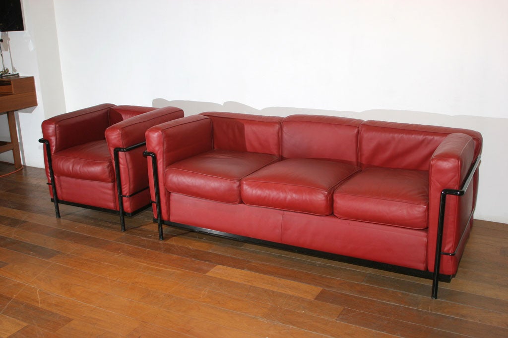 Official matched set of Cassina engraved Le Corbusier LC2 Three-Seat Sofa & Lounge Chair, c.1978 SET, in Great Structural and Cosmetic Condition. Leather & Down-Wrapped Cushioning are in GREAT SHAPE!!! Upholstered in Deep Brick or Garnett Red. Color