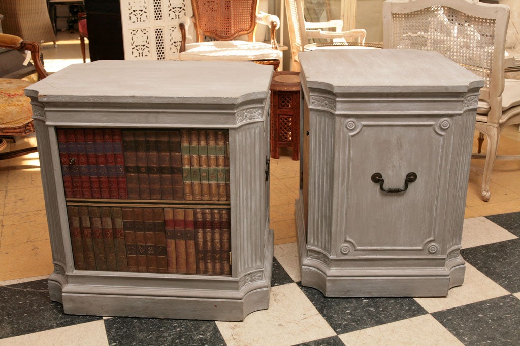 Pair of end tables with faux painted books that opens up to open storage.  Great as night table or end tables.