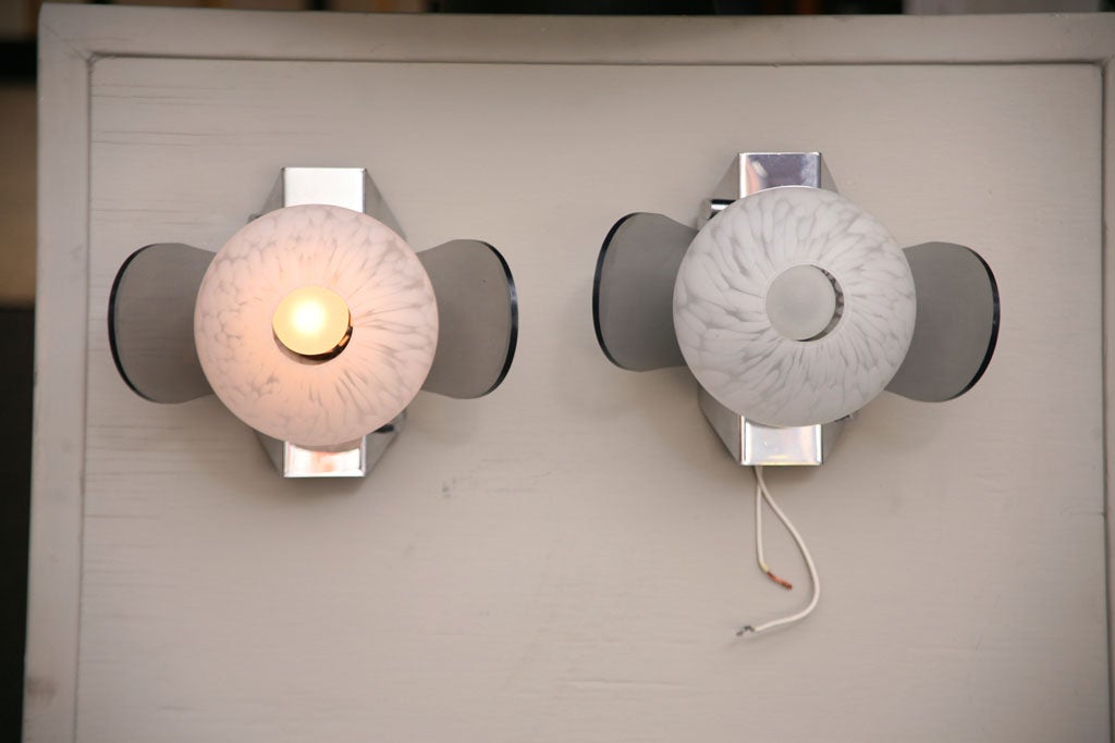 REDUCED FROM $575....With their blown Murano globes, smoked Lucite wings and bright chrome bases, these sconces are a modern vision. A stylised flower bud with leaves comes to mind. Unique angular shaped bases have decorative chrome buttons.