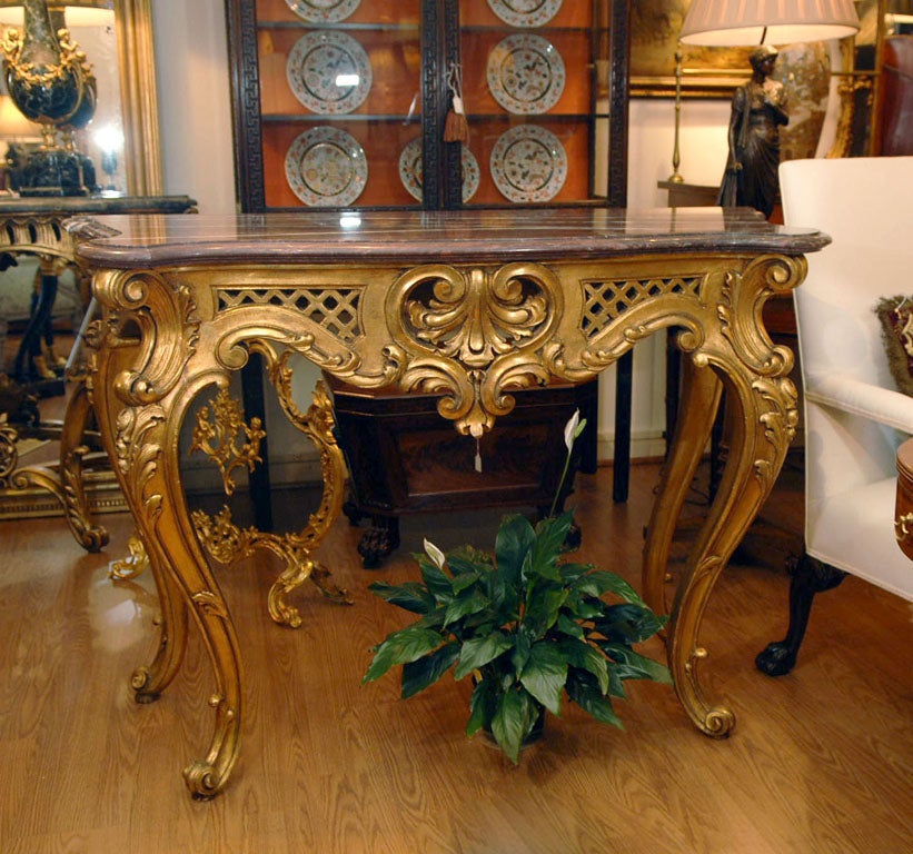 19th Century Louis XV gilded and hand carved console with marble top. Beautful rococo design, original rouge marble top.