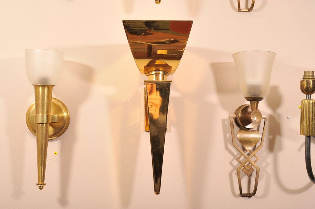 BORIS LACROIX <br />
Pair of Art Deco Gilded Brass Wall Sconces, 1930’s<br />
Height: 15” (38 cm.)