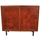 Harvey Probber sliding door cabinet with patchwork leather doors