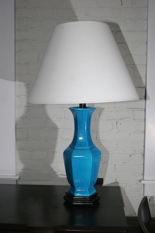 Bold pair of jar-shaped porcelain lamps, mounted on black-lacquered wood bases. Price is for the pair.