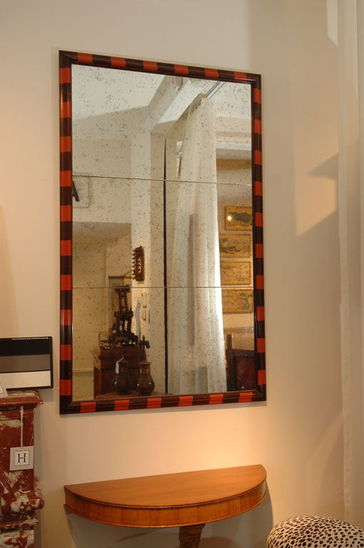 Pair of Ogee-Frame Wood-tone and Orange Striped Frames, <br />
with Antiqued Mirror Glass