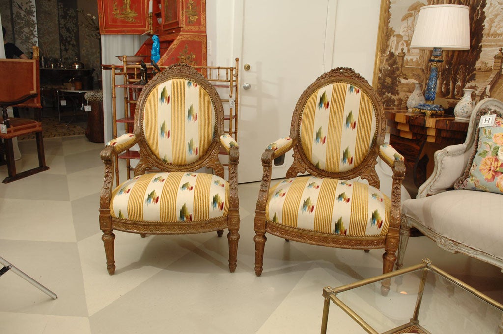 Pair of Antique French Carved Armchairs, <br />
in giltwood and gold finish, upholstered in Scalamandre Silk Velvet