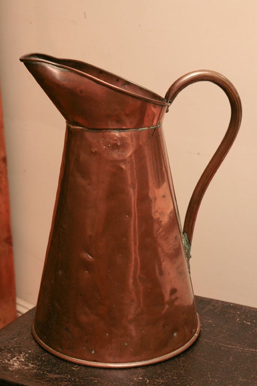 This tall copper in insribed 29 JM on its wide base. It is in wonderful condition and quite heavy.