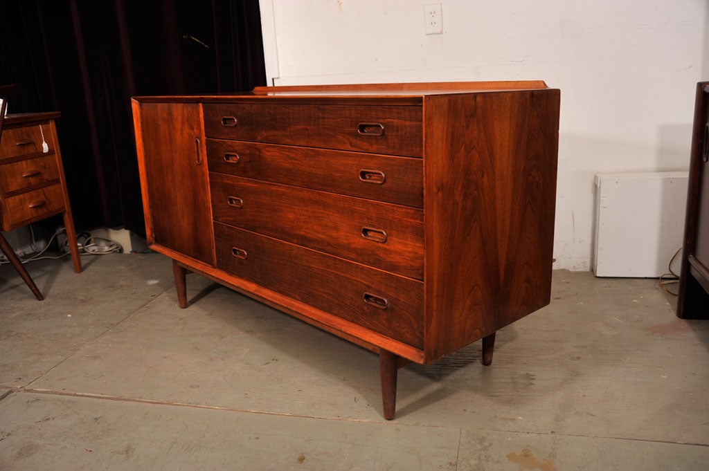 Scaled-down Danish credenza with four petite drawers and a side compartment with one shelf.