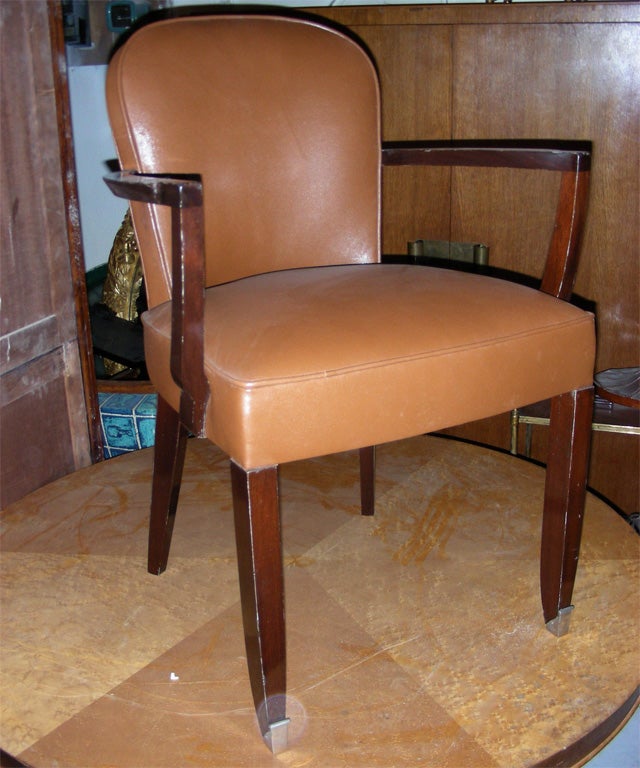 1940s desk armchair by Jules Leleu in rosewood with leather upholstery.