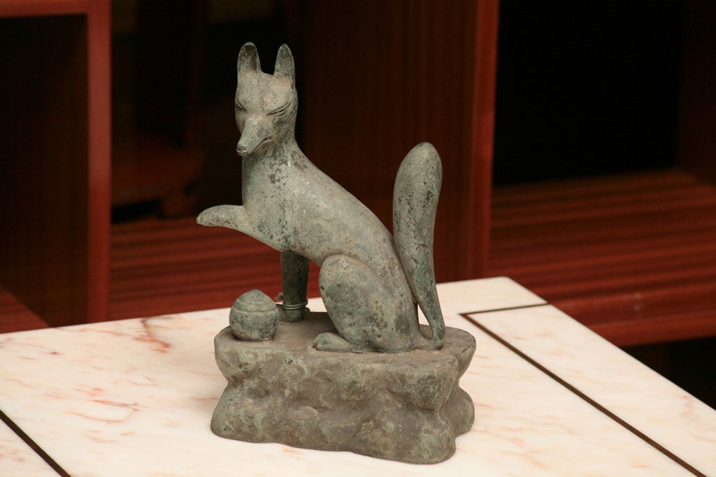 Japanese oxidized bronze fox ( Inari) a guardian figure.  A guardian Shrine piece.<br />
(one paw raised above the flaming pearl).
