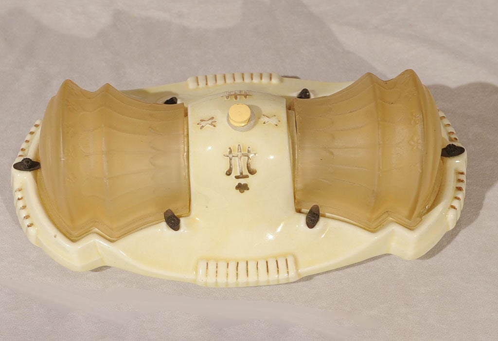 Unusual Art Deco ceramic and glass flush mount chandelier. Practical for any bathroom or small area. A very special combination of glass and ceramic makes this lovely fixture a great addition to any room. A very rare item indeed.