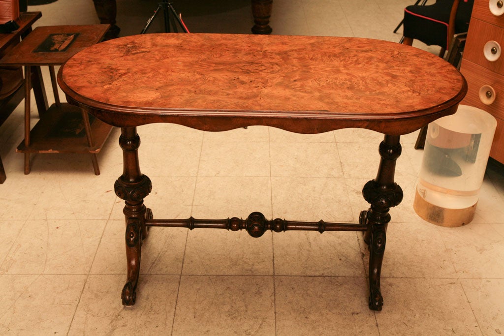 late 19th century sofa table in walnut with burl walnut top, turned legs with carved rondels on legs and stretcher