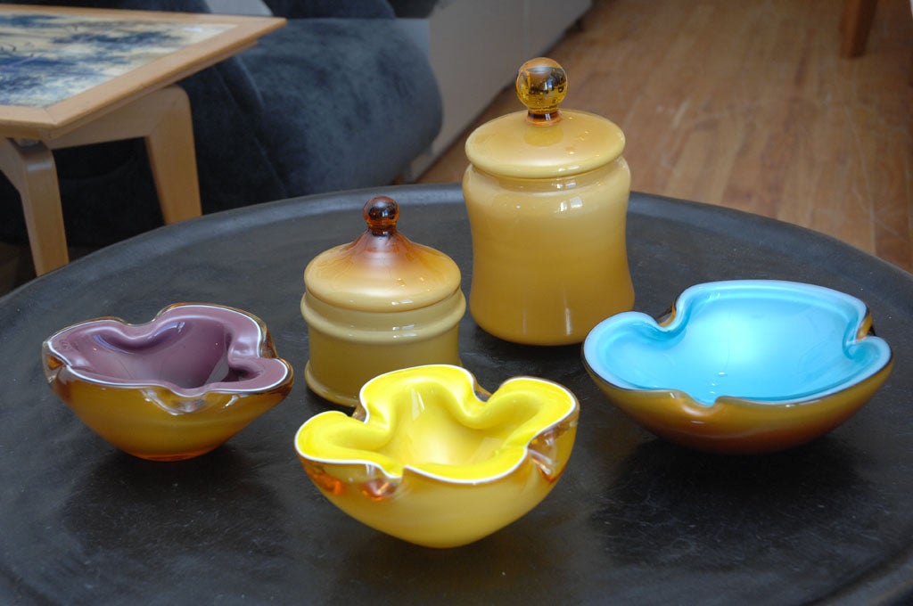 Beautiful color combinations with caramel Venetian glass. Group of 3 bowls and 2 lidded jars.Call for individual prices & measurements.