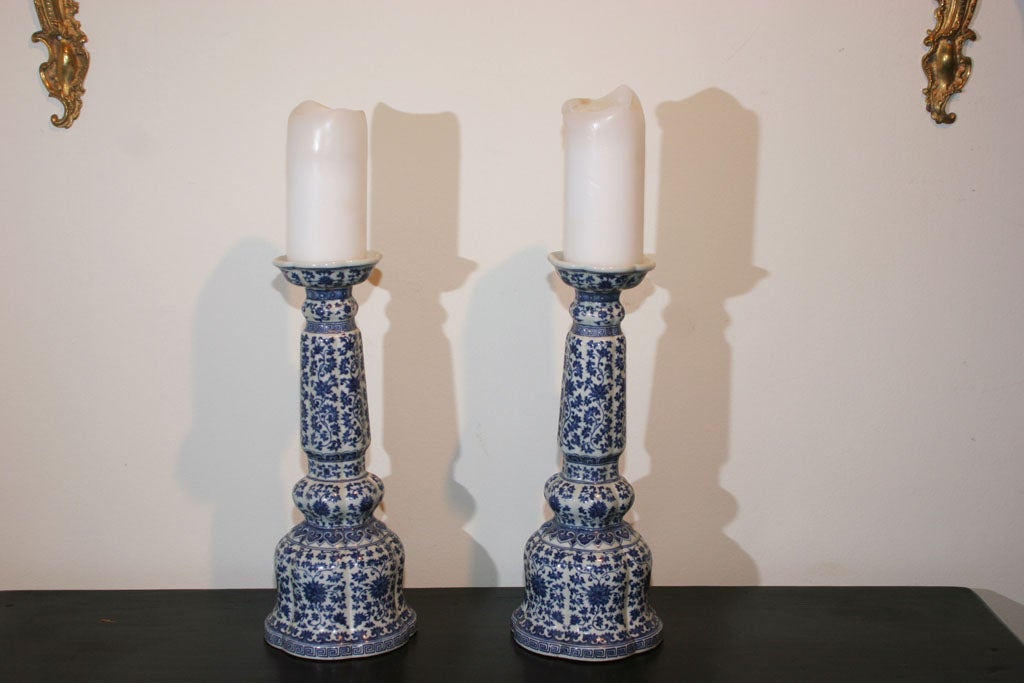 A pair of blue and white china candlesticks