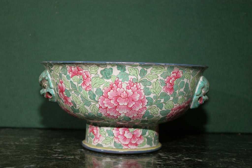 Fine antique Chinese stoneware censer for burning incense, decorated in bright overglaze enamels with stylized peonies and two shades of green foliage with a rimmed edge and foot and having two pairs of masks on opposite sides. Chinese, circa 1880.