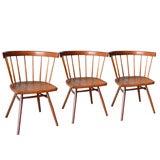 Four Walnut dining chairs designed by George Nakashima for Knoll