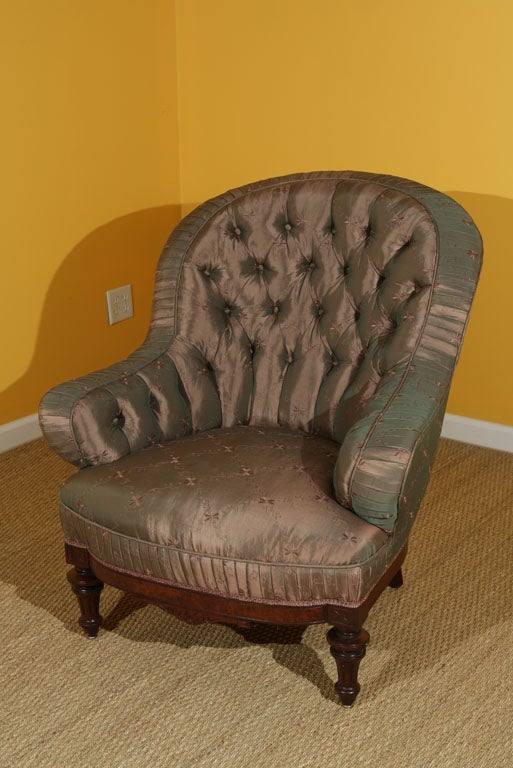 Offered here is a Late 19th century Fabulously Silk Upholstered Library Chair with tufted back and rolled pleat gallery and arms.  Carved mahogany frame.  Generous size and seat- comfortable for tall men.