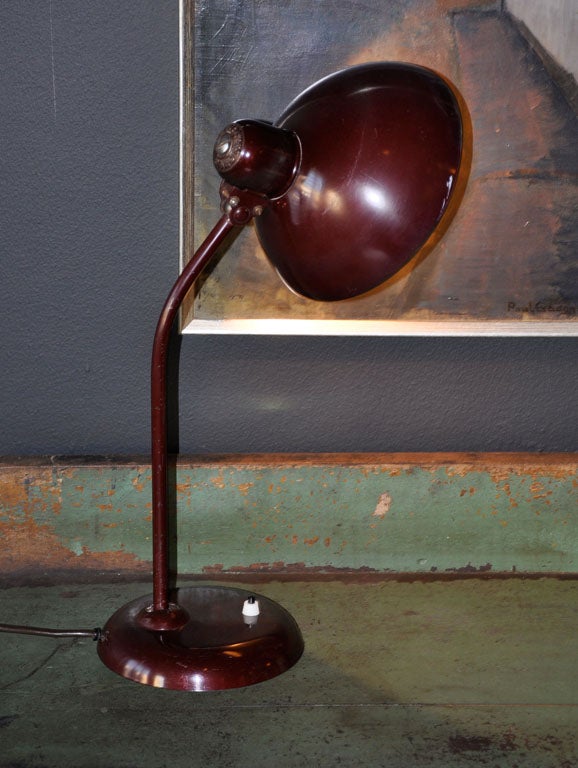 Rare burgundy red colored Kaiser Idell adjustable desk lamp. Enameled metal, steel with bakelite fitting. Germany, 1940s.

Rewired. 

