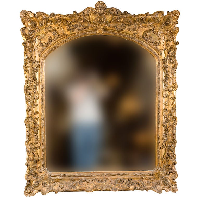 Elaborately Carved Gilt Mirror For Sale