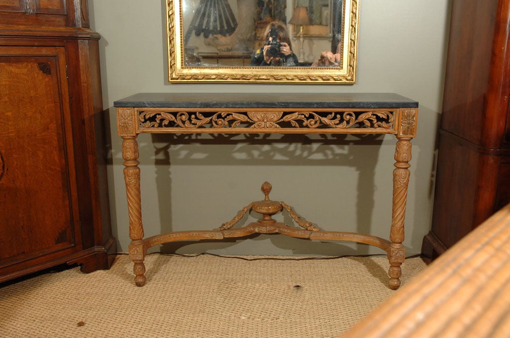 Pair of Console Tables of Carved Walnut with Black Marble Tops