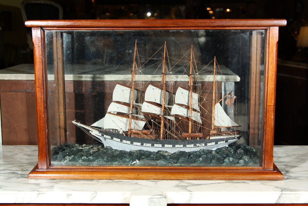 A fantastic four masted sailing schooner model in mahogany glass case. Right out of a NJ Estate.