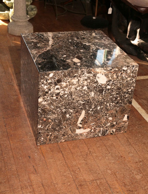 A beautifully figured Italian marble cube table. The stone choice is good and full of heavy dramatic veining. Made from a number of slabs mitered together reducing weight but still retaining the geometric sculptural modern monumentality so effective