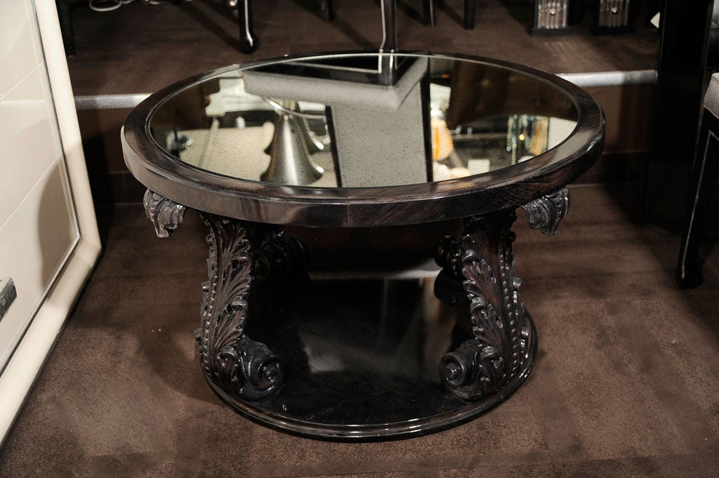 Ebonized walnut occasional table by the fabled American maker Grosfeld House, where some of the most renowned designers of the 20th century, including Vladimir Kagan and Lorin Jackson got their start. This piece features two tiers with an antique