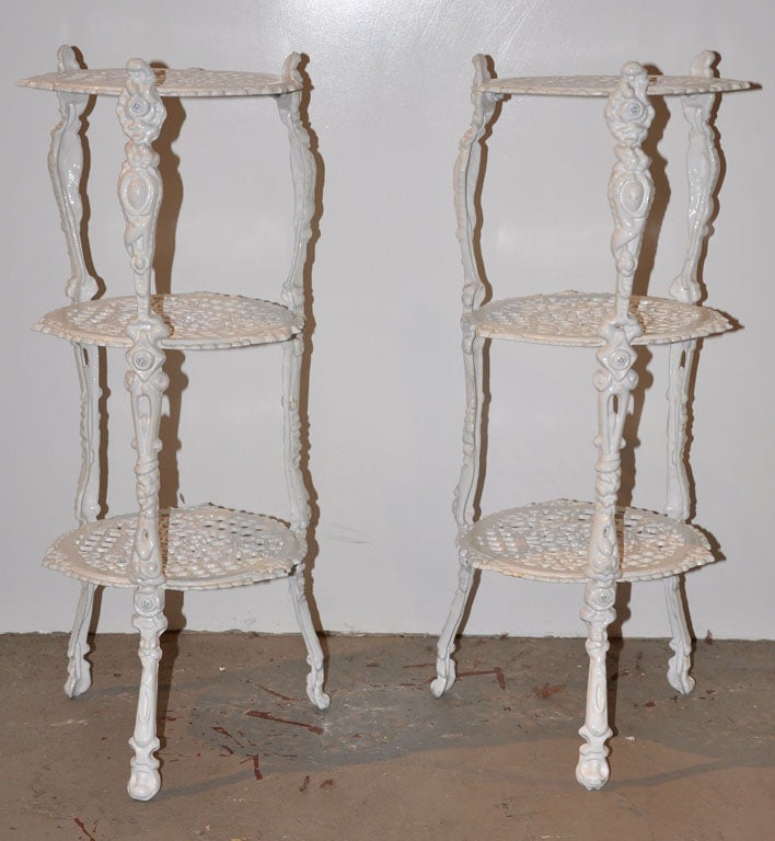 Ornate French three-tiered iron plant stands powder coated in a high-gloss white enamel with organic detailing on the legs. Made of solid iron and perfect for indoors or out. Only one available.