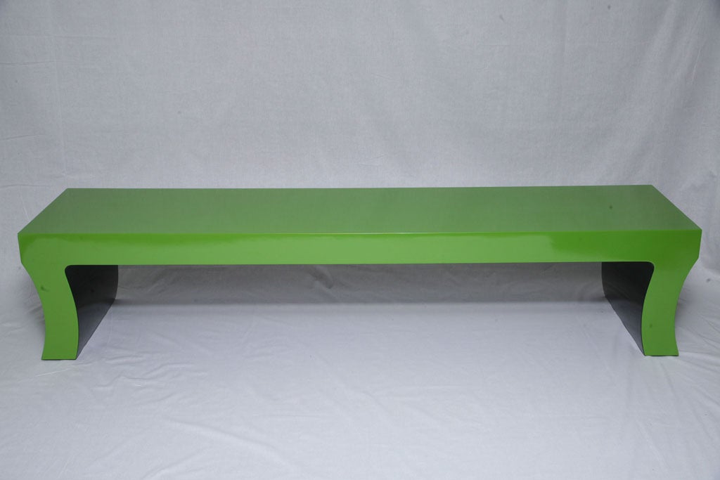 Long and sleek Hollywood Regency style bench or coffee table measuring an impressive 7' long with vivid green gloss lacquer surface, and black lacquer underside. Attractive curvature to the legs.<br />
<br />
In case of e-mail issues or if you