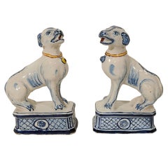 A Pair of Blue and White Delft Dogs