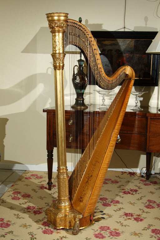 Their Style 2 harp with 45 strings, double action. Engraved maker's mark on the bronze plaque. Fruitwood and parcel gilt with foliate scrolled decoration on the frame.