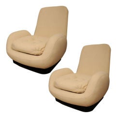 Pair of low armchairs by Pierre Guarriche