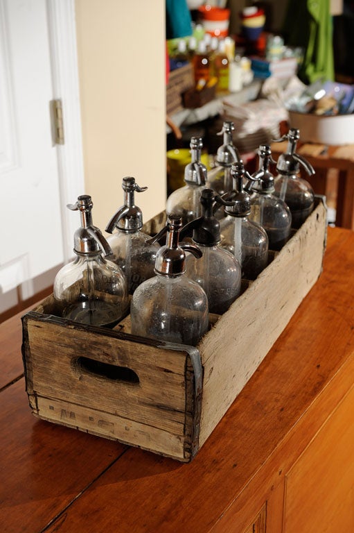 A variety of nine seltzer bottles from different companies in New Jersey.  Some even have seltzer still in them!  Sold as a set.  But if you're interested in a few, please email us.  Bottle carrier measures 23 3/4 wide x 9 1/4 deep x 6 1/4 tall. 