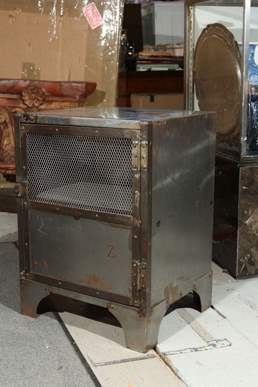 Pair of metal industrial stands with wired locker doors. <br />
<br />
PRICE IS FOR EACH.