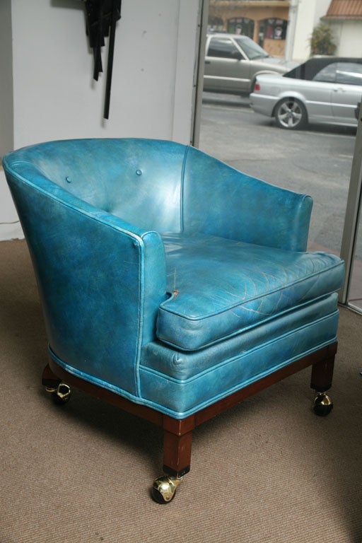 Weathered leather tufted arm chair a traditional piece in a very bold and beautiful color