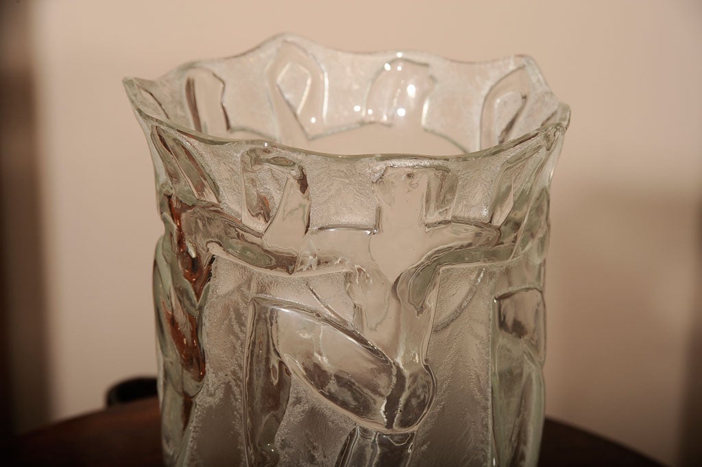 French Art Deco glass vase molded with dancing female figures, from circa 1930, inscribed Degue with artist's cartouche on the underside.