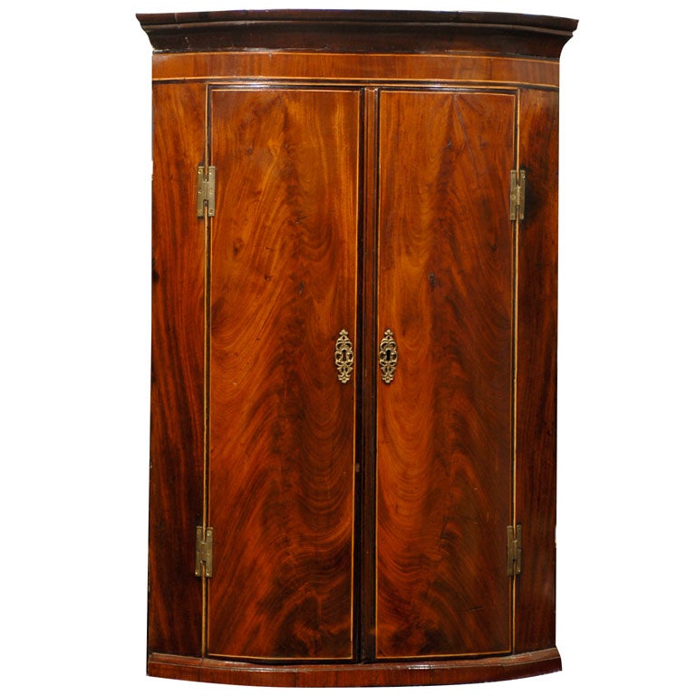 George III Period Bowfront Corner Cupboard of Flame Mahogany