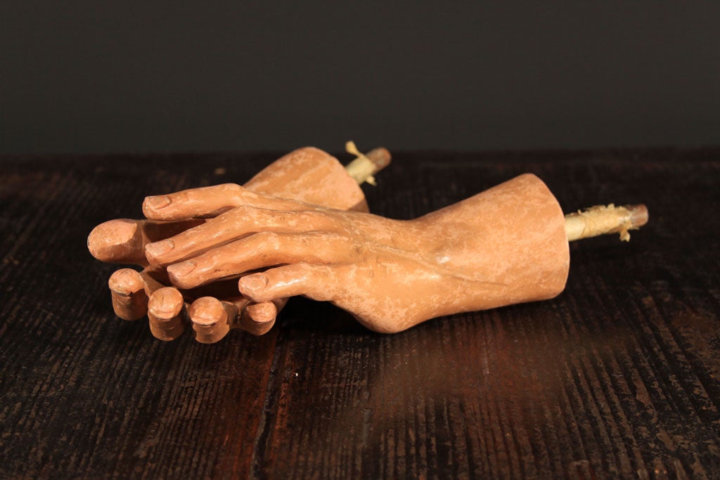 A pair of carved and painted wooden hands from a Philippine Santos figure. Approximately 8